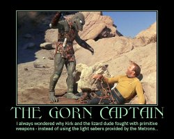 The Gorn Captain --- I always wondered why Kirk and the lizard dude fought with primitive weapons - instead of using the light sabers provided by the Metrons...